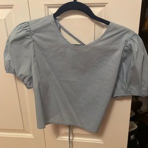 Blue puffy sleeved top